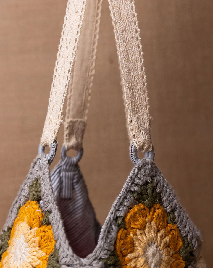 Daisy crochet bucket bag, handmade eco-friendly handbag by The Mango House Trust
