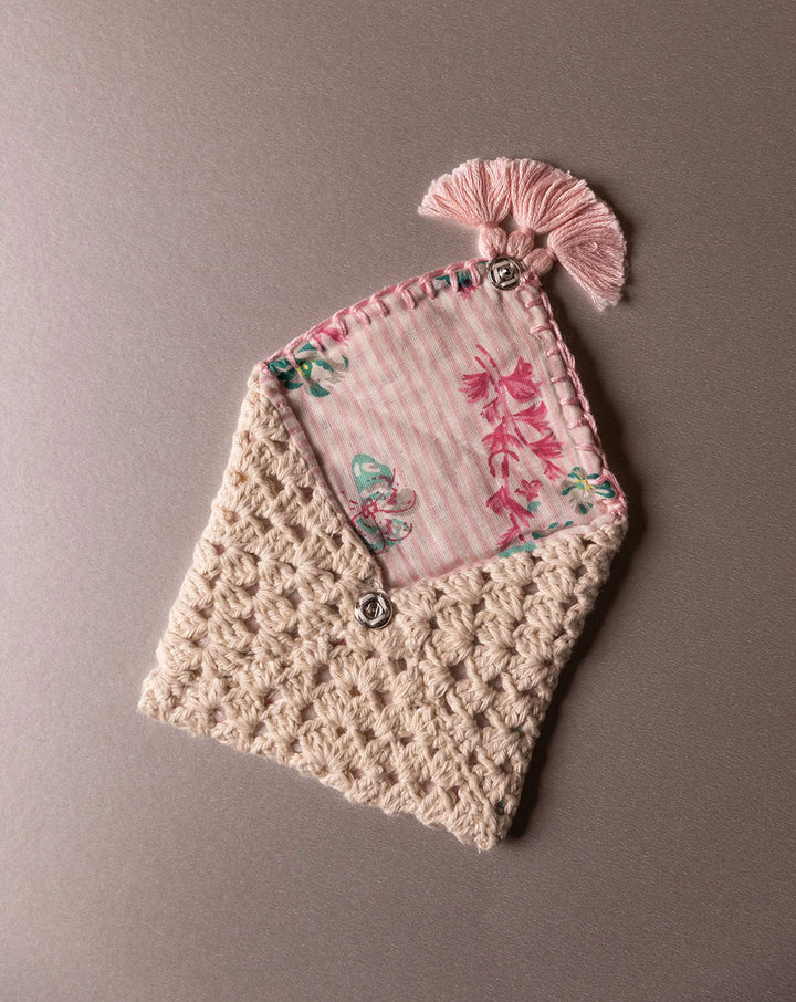 Handmade crochet pouch, eco-friendly and stylish accessory by The Mango House Trust