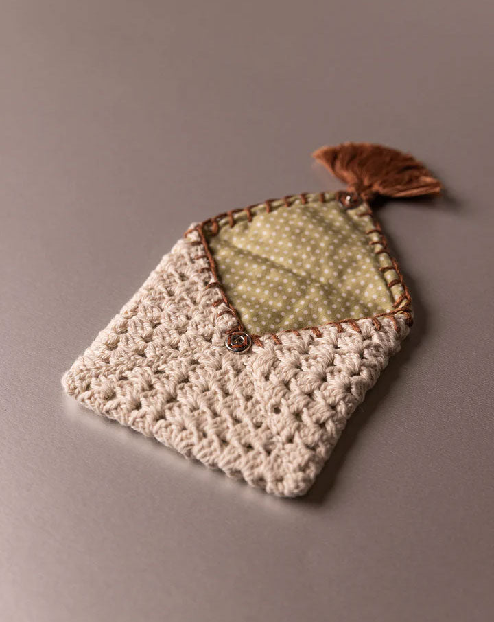 Handmade crochet pouch, eco-friendly and stylish accessory by The Mango House Trust