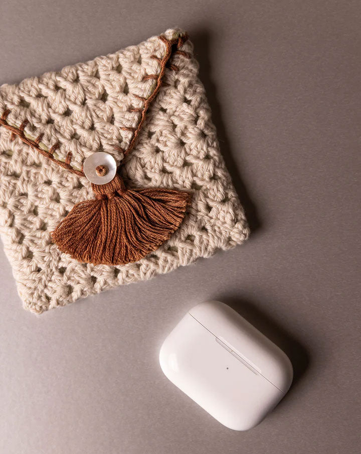 Handmade crochet pouch, eco-friendly and stylish accessory by The Mango House Trust