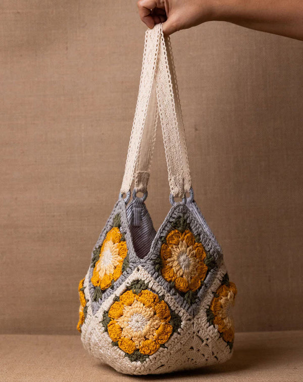 Daisy crochet bucket bag, handmade eco-friendly handbag by The Mango House Trust