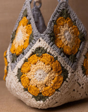 Daisy crochet bucket bag, handmade eco-friendly handbag by The Mango House Trust