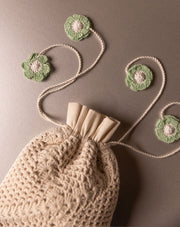 Handmade crochet pouch, stylish eco-friendly accessory by The Mango House Trust