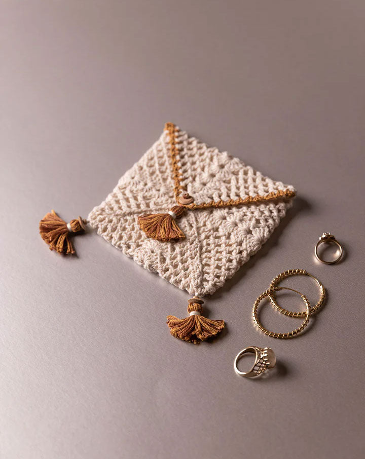 Handcrafted crochet pouch, eco-friendly artisan accessory by The Mango House Trust